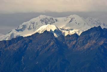The snow-capped Mt. Narshing under the Kanchenjunga range shines bright as seen from Temi Tarku in...