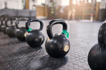 Naklejka na ściany i meble Fitness, crossfit or zoom of kettlebell in gym or New york studio for weightlifting exercise, muscle development or wellness workout. Metal, steel or heavy iron for health, training or sports goal