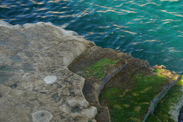 celebrity celebrities names graffiti on saint peter pools Malta rock formation