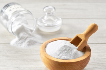 sodium bicarbonate on a white wooden table, close-up.