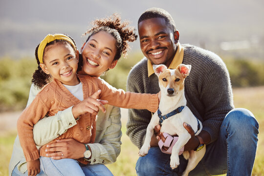 Family, portrait and dog at park with girl and parents relax, bond and play, happy and smile in nature. Black family, pet and having fun on a field, embrace and enjoy quality time with jack russell