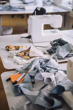 Leftovers of fabric on workbench at workshop