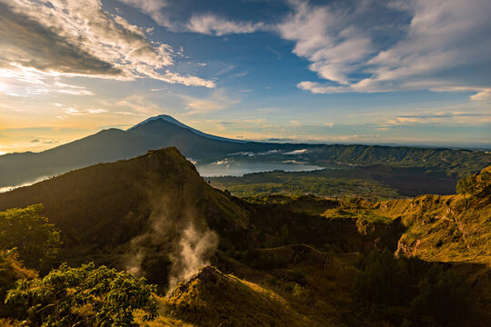 Breathtaking sunrise over Abang mountain, view from Batur volcano and Batur lake, Bali, Indonesia