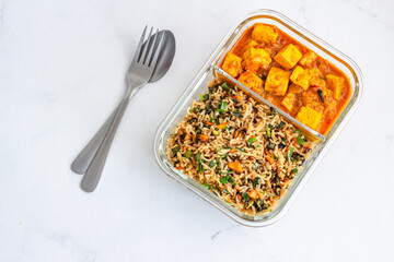 Indian Combination Lunch of Fried Rice and Paneer Butter Masala in a Lunch Box