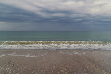 Obraz premium Coastline landscape photo. Ocean view. Beautiful nature scenery photography with sea tide on background. Idyllic scene. High quality picture for wallpaper, travel blog, magazine, article