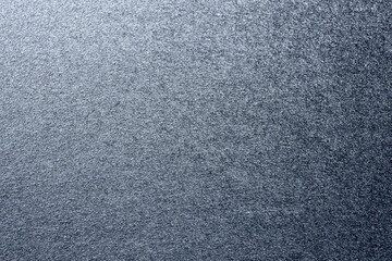 macro photography of black and silver spray paint on white paper