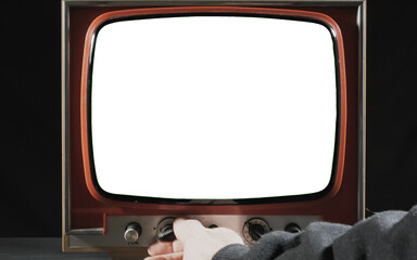 The hand of a man turning on and off a retro vintage tv set, with an empty blank screen (replace it...