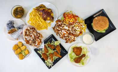 Chef of the kebab restaurant, traditional Turkish and Arabic food, overhead shot of the multiple dishes