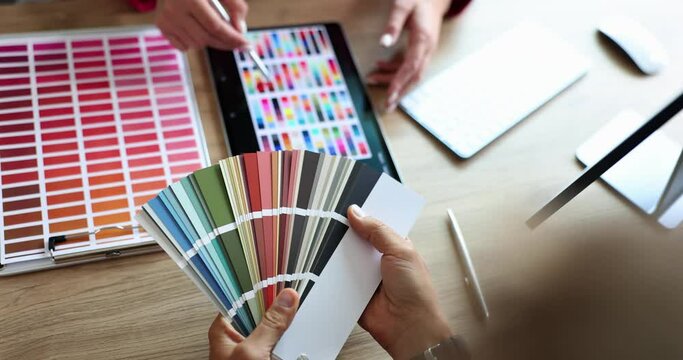 Meeting designer and client in office and coloring and branding of product in design studio