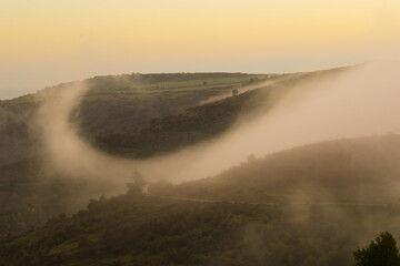 Cloud in form of a vertical vortex in a landscape of the Ardeche in France near 07000 Privas