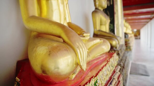 Thailand Gold Buddha Buddhist Statue Close Up at Beautiful Bangkok Temple at Wat Pho (Temple of the Reclining Buddha), Gold Leaf Buddha in Lotus Position, Asia Buddhism Symbol