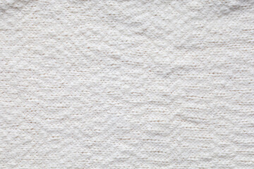 Texture of knitted woolen antique white fabric