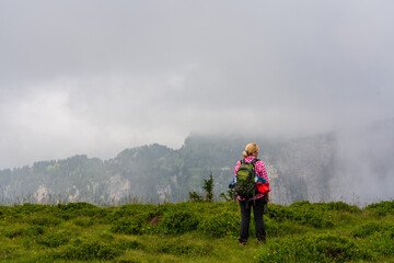 Backpacker hiking in the mountains in Switzerland.