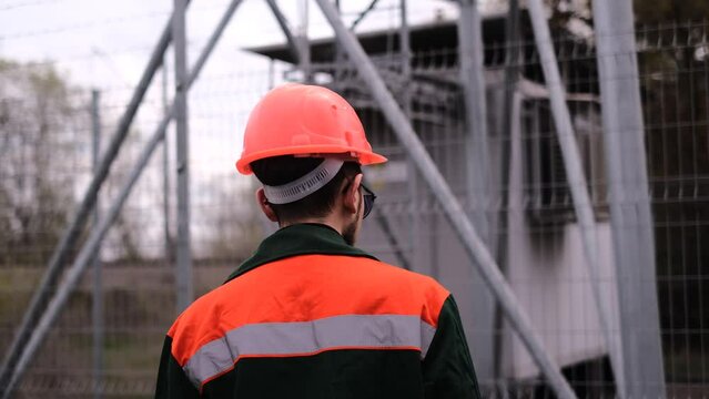 an electrician at a power plant inspects the damage and estimates the amount of work