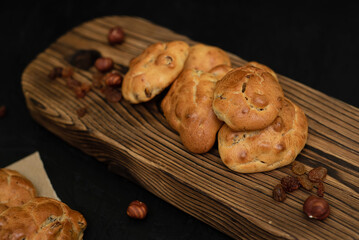 Biscuits with raisins and nuts on a wooden background