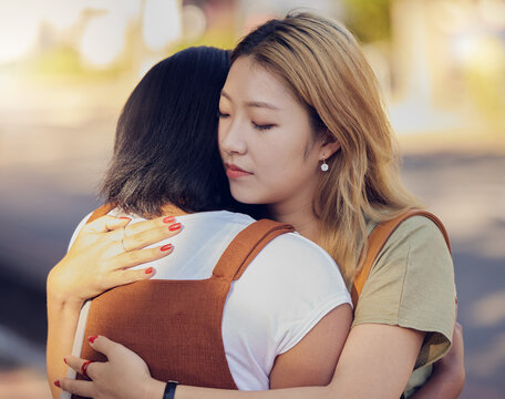Love, women and hug for connect, sad and support for understanding with problem, compassion and calm together. Asian woman, girl and embrace friend, loving and help to console in kind relationship