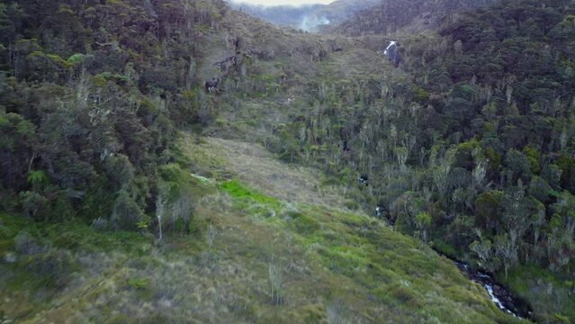 Mountain climb with waterfall