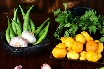 pequi fruit typical Brazilian food, okra seasonings, salad and melted cheese au gratin on blurred background