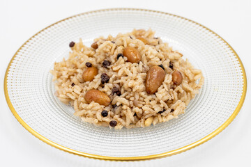 Rice with currants and almonds on a white background. Traditional Turkish cuisine delicacies. Local name ic pilavi. close up