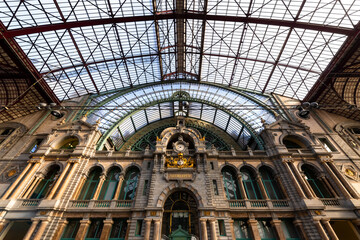 Antwerp central station (Antwerpen Centraal) is a historic public railway station and impressive stone-clad building with iron and glass train hall. Major architecture monument attraction in Belgium.