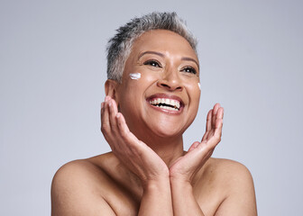 Skincare, cream and senior black woman in studio with happy facial, makeup cleaning or sunscreen...