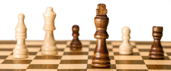 Chess pieces on a chess board - obrazy, fototapety, plakaty