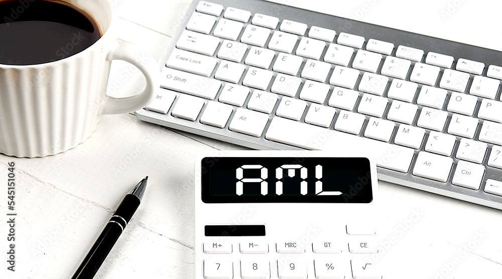 Poster aml text on calculator with keyboard and coffee