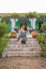Fototapeta premium Happy young woman on a farm in the countryside