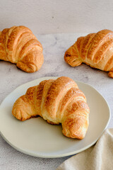 white background marble with croissants and napkin minimalism