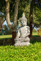 detail of buddha statues posed outdoors