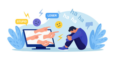 Cyber Bullying. Sad teenage man sitting in front of computer with dislike in social media, mockery. Depressed young person after insult, swear, verbal abuse in internet. Depression, stress concept