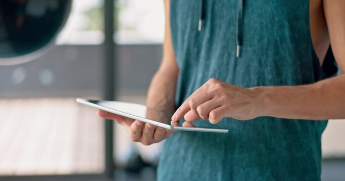 Fitness, tablet and personal trainer on social media at gym posting exercise, workout or training online content. Schedule, digital and mans hands typing or networking with coaching clients on an app
