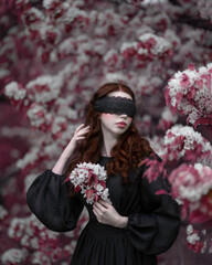 Themis girl blindfolded in the red garden