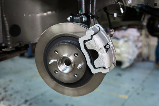 Assembled car suspension with brake mechanism in workshop
