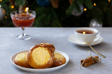 cheesecake with streusel on a concrete background, New Year's tea party with pies and jam near the Christmas tree