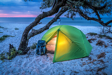 Tourist tent on the beach at sunrise