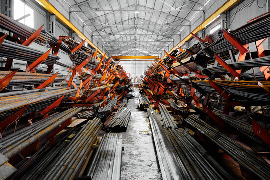 Rolled metal products on large racks in cold storehouse