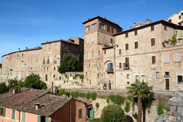 Fototapeta na wymiar Ancient medieval stone houses in the historic center of Perugia in via Cesare Battisti above the medieval aqueduct of the Fontana Maggiore.