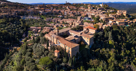 Fototapeta na wymiar Italy travel and landmarks. Tuscany region, aerial panoramic view of old town Montalcino