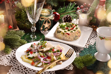 Fototapeta na wymiar Herring salads on Christmas table