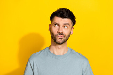Portrait photo of young funny guy bearded pouted lips looking empty space advertisement unsure...
