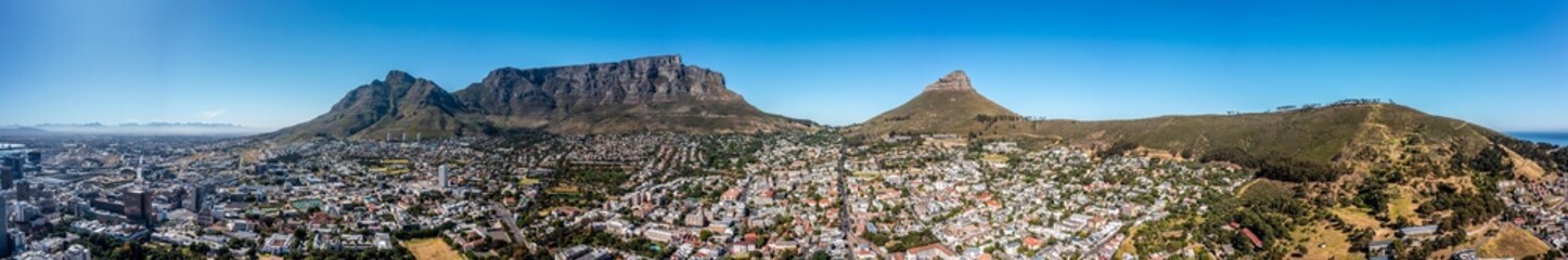 Fototapeta premium panoramic aerial view of Cape Town City with Devil's Peak, Table Mountain, Lion's Head and Signal Hill in the background - aerial panorama landscape 