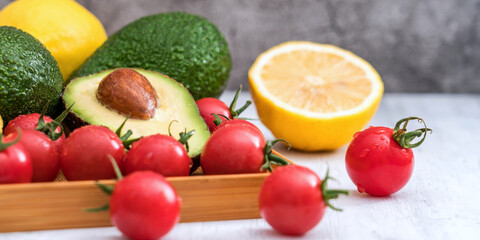 Avocado, Lemon and Cherry Tomatoes in a Tray