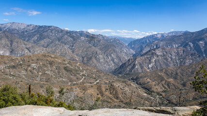 Fototapeta na wymiar View of the mighty gray green mountains at Kings Canyon, National Park, California, USA