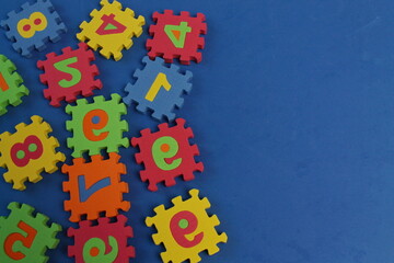soft puzzles with numbers on a blue background, colorful numbers, math