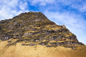 View of a rocky mountain under the blue sky in Iceland