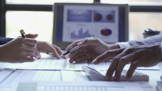 Group of business men and women holding statistical data and charts of brainstorming financial reports. Financial analysis with the manager of a large company. 4k video