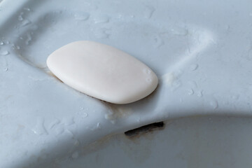 Soap in a bathroom on wet surface - shallow focus