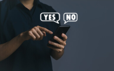 Businessman using smartphone to show yes or no. Concept of voting decision.	
