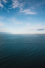 Vertical minimalistic shot of the sky on a sunny day